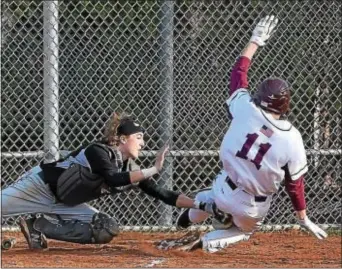  ?? PETE BANNAN — DIGITAL FIRST MEDIA ?? Ridley catcher James Becker tags Conestoga’s Will Mauro out at home plate as Mauro tried to score the tying run in the 7th inning of the Central League matchup at Ridley Monday afternoon. Mauro was called out as the Green Raiders held on for a 1-0...