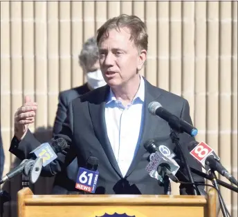  ?? H John Voorhees III / Hearst Connecticu­t Media ?? Gov. Ned Lamont speaks after visiting a COVID-19 vaccinatio­n clinic for staff of local child care providers at Rodgers Park School in Danbury earlier this month.