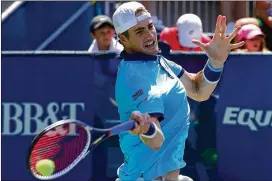  ?? KEVIN C. COX / GETTY IMAGES ?? John Isner, who defeated Gilles Muller on Saturday, will seek his 12th career ATP World Tour win in today’s BB&T Atlanta Open final at Atlantic Station.