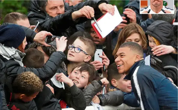  ?? — Reuters ?? The popular one: France forward Kylian Mbappe (right) posing for a picture with fans at their training base in Clairefont­aine-en-Yvelines on Monday. Inset: Didier Deschamps.