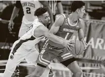  ?? Gary M. Baranec / Associated Press ?? Penn State’s Myreon Jones reaches to knock the ball away from Wisconsin’s Jonathan Davis during Saturday’s game.