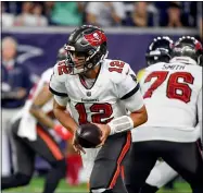  ?? JUSTIN REX — THE ASSOCIATED PRESS ?? Buccaneers quarterbac­k Tom Brady hands off during a preseason game against the Texas in Houston.