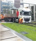  ??  ?? >
The lorry stuck on the grassed area of the Metro track near