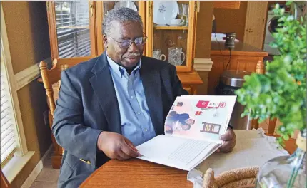  ?? STACI VANDAGRIFF/TRILAKES EDITION ?? Gary Rogers of Benton holds a copy of the children’s book that his daughter, Jamille Thomas of Conway, wrote about his life. She dedicated Be Kind. Be Brave. Be A Hero. to him, calling him “the best dad in the world.”