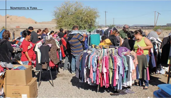  ??  ?? AVBOVE: Clothing is distribute­d to the homeless and needy families by Crossroads Mission.