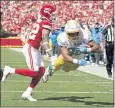  ?? CHARLIE RIEDEL — THE ASSOCIATED PRESS ?? Chargers running back Austin Ekeler dives past Chiefs defender Tyrann Mathieu and into the end zone for a TD.