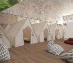  ?? (courtesy) ?? A “POD” (left) and an indoor tent complex at Tel Aviv’s new Spot Hostel, set to open in April.