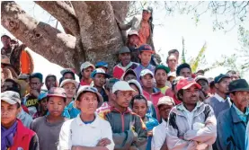  ?? -— AFP ?? This file photo taken on October 6, 2016 in Soamahaman­ina shows people protesting the presence of the Jiuxing Chinese mining company near the mining site.