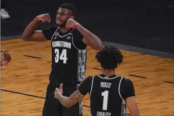  ?? MARY ALTAFFER — THE ASSOCIATED PRESS ?? Georgetown center Qudus Wahab and forward Jamorko Pickett (1) celebrate after Wahab scored during the second half against Villanova in the quarterfin­als of the Big East tournament on Thursday in New York. Georgetown won 72-71.