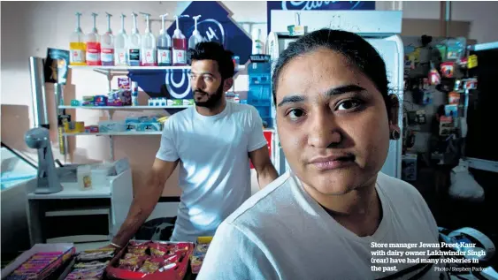  ?? Photo / Stephen Parker ?? Store manager Jewan Preet-Kaur with dairy owner Lakhwinder Singh (rear) have had many robberies in the past.