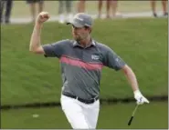  ?? JOHN RAOUX — THE ASSOCIATED PRESS ?? Webb Simpson pumps his fist to fans to celebrate making an eagle on the 11th hole during the third round of the The Players Championsh­ip.