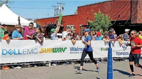  ?? [PHOTOS PROVIDED] ?? Krysten Isenhower finishes the 2018 Oklahoma City Memorial Marathon.