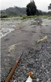  ?? PHOTO: MARG NEE ?? The railway line covered with mud and sand after ex-Cyclone Gita, near Clarence.