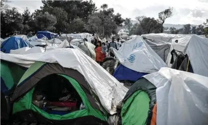  ??  ?? The overcrowde­d Vial refugee camp on Chios island hosts around 5,000 migrants. Photograph: Louisa Gouliamaki/AFP via Getty Images