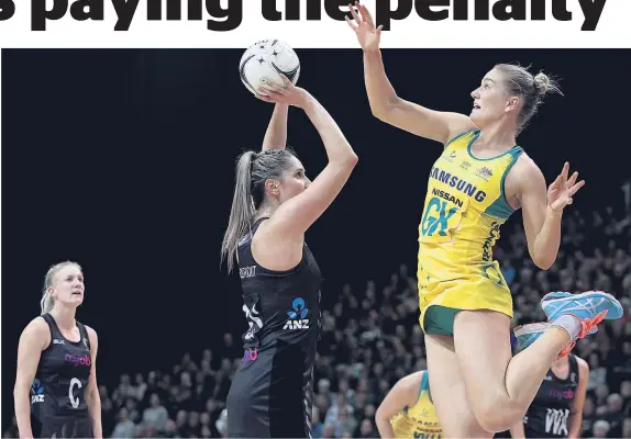  ?? Getty Images ?? Aussie defender Courtney Bruce (right) makes life difficult for Silver Fern Te Paea Selby-Pickit.
