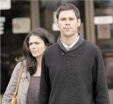  ?? Greg Southam/ Edmonton Journal ?? Sawyer Robison walks out of the Wetaskiwin Court House with his girlfriend Friday after being found not guilty of two counts of attempted murder, as well as assault and weapons charges.