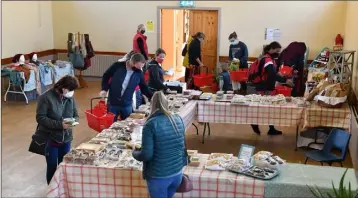  ??  ?? Early morning shoppers at the Ravensdale Country Market.