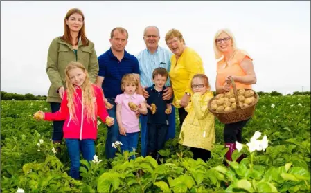  ??  ?? Three generation­s of the Pettit family pictured on their potato farm in Carne with Aoife Hearne, Dietitian.