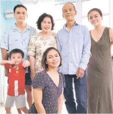  ?? ?? Abigail (seated) with her family.