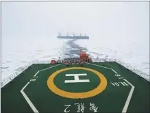  ?? ZHOU YUAN / XINHUA ?? Icebreaker vessel Xuelong 2, currently on an Antarctic expedition, breaks the ice on Nov 30 to clear the way for the cargo ship Tian Hui, which is carrying constructi­on material for China’s new Antarctic station. The two ships are part of China’s 40th scientific expedition to Antarctica. The expedition team set sail on Nov 1, and the mission is expected to last over five months.