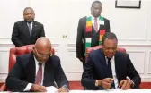  ?? ?? The two leaders witness the signing of agreements by Lands, Agricultur­e, Fisheries, Water and Rural Developmen­t Minister Dr Anxious Masuka (right) and Mozambique’s Public Works, Housing and Water Resources Minister Engineer Carlos Alberto Fortes Mesquita at State House in Harare yesterday