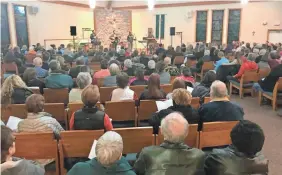  ?? JAMES B. NELSON/USA TODAY NETWORK ?? Hundreds of people gather for a “praise and gratitude” service celebratin­g the return of missing Wisconsin teenager Jayme Closs at St. Peter Catholic Church on Sunday night.