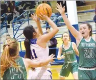  ?? Westside Eagle Observer/MIKE ECKELS ?? Surrounded by Lady Panthers Jacy Riddle (14), Abby Brantner (3) and Allie Edmonds (20), Kaylee Morales (Decatur 11) puts up a last-ditch shot with only a few seconds left, sending the contest into overtime during the Decatur-Yellville conference matchup in Decatur Jan. 28.