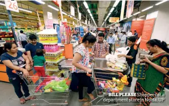  ??  ?? BILL PLEASE Shoppers at a department store in Noida, UP