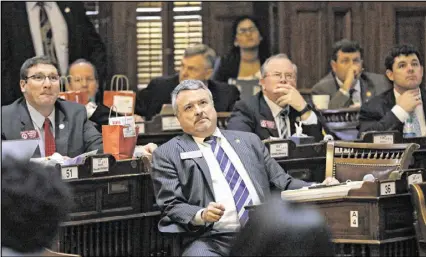  ?? BOB ANDRES / BANDRES@AJC.COM ?? Rep. Earl Ehrhart, R-Powder Springs, who presented House Bill 51, watches as the vote on his bill comes in. The House voted 115-55 to approve HB 51, commonly referred to as the campus rape bill. Critics say the bill erodes victims’ rights.