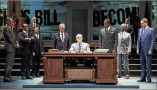  ?? ROGER MASTROIANN­I ?? Steve Vinovich, center as President Lyndon Baines Johnson, and members of the ensemble perform in the Cleveland Play House production of “All the Way.”
