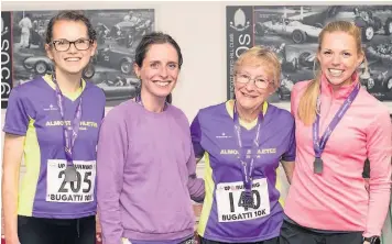  ??  ?? Helena Youde, Ellie Laney and Hattie Jenkins with Virginia Poulton at the Bugatti 10K