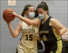  ?? JULIA MALAKIE / LOWELL Sun FILE ?? Littleton's Sara Macdonald is defended by St. Bernard's Lizzy Gardner during a basketball game this winter.