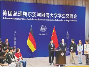  ?? REUTERSPIC ?? Scholz attending an event with students at Tongji University in Shanghai. –