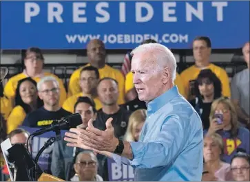  ?? Saul Loeb AFP/Getty Images ?? JOE BIDEN campaigns in Pittsburgh last month. The latest Quinnipiac University poll in Pennsylvan­ia found Biden leading Trump 53% to 42%, with especially wide margins among independen­t voters and women.