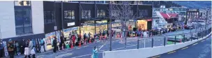  ?? PHOTO: TRACEY ROXBURGH ?? Waiting . . . Queues outside NZSki’s Snow Centre on Brecon St, Queenstown, yesterday morning.