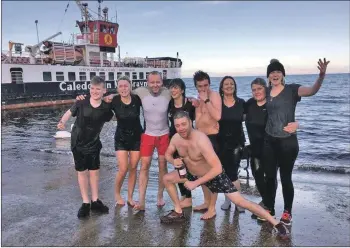  ??  ?? Known as the Lochranza Loonies, these swimmers took part in the second annual dook. Photograph Gail Scott.