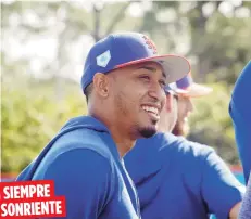  ??  ?? SIEMPRE SONRIENTE Nada le quita al naguabeño su amplia sonrisa. Esto porque confía en su talento como lanzador.