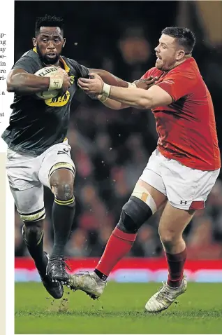  ?? STU FORSTER/GETTY IMAGES ?? Siya Kolisi Wales, seen here waltzing past Rob Evans of Wales, was yesterday appointed Springbok captain.