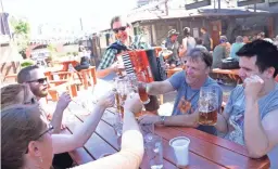  ?? THE REPUBLIC ?? Dale Matthies plays a song about drinking during the OktoberFes­t celebratio­n at Brat Haus on Sept. 21, 2013.