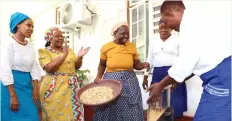  ?? ?? First Lady Dr Auxillia Mnangagwa and her Botswana counterpar­t Mrs Neo Jane Masisi admire as Ms Priscilla Mupanga taught Botswana women how to prepare peanut butter from groundnuts at Zimbabwe House on Thursday