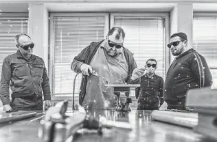  ?? Laetitia Vancon / New York Times ?? A welding teacher leads a class for immigrants at Bildungskr­eis Handwerk, a regional training hub in Dortmund, Germany. Young, skilled workers are being recruited across the globe.