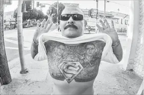  ??  ?? “SUPER HOMIE” posed for Rafael Cardenas in Boyle Heights for the book “Mas Aca.”