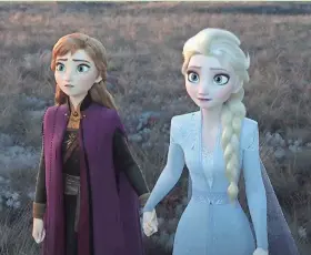  ??  ?? Anna and Elsa face the unknown together in “Frozen II.”