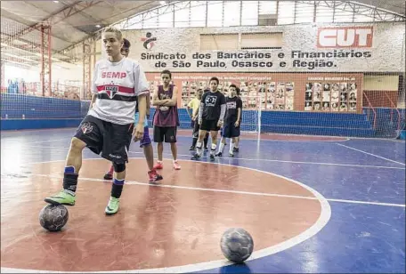  ?? Photograph­s by Gui Christ For The Times ?? PLAYERS practice in Sao Paulo, Brazil. “These guys are my family,” says one. “We laugh, we fight, we make up. I didn’t have that before.”