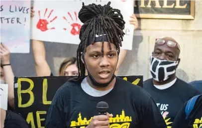  ?? ASHLEE REZIN GARCIA/SUN-TIMES FILE PHOTO ?? Caleb Reed, a junior at Mather High School in West Ridge, speaks during a press conference outside City Hall in June. He was fatally shot a month later.
