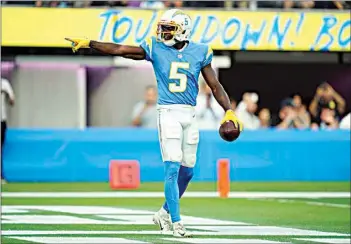  ?? ASHLEY LANDIS / AP ?? Chargers wide receiver Josh Palmer celebrates after catching a touchdown pass during the first half of an NFL preseason game against the 49ers on Sunday in Inglewood.