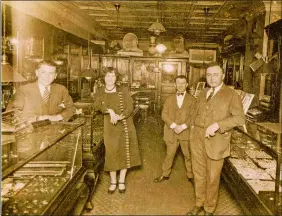  ?? COURTESY THE MALLOVE FAMILY ?? Members of the Mallove family believe this was taken inside the store when it was located at 111 Bank St., which would date it to sometime between 1919 and 1930. Morris Mallove is pictured at far right.