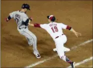  ?? SUSAN WALSH — ASSOCIATED PRESS ?? Reds first baseman Joey Votto (19) tags out Yan Gomes during the seventh inning at the Major League Baseball AllStar game July 17 in Washington, D.C.