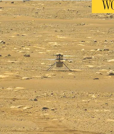  ?? HANDOUT/NASA/JPL-CALTECH/MSSS/ASU/AFP VIA GETTY IMAGES ?? NASA'S Ingenuity Mars Helicopter is caught by cameras aboard NASA'S Perseveran­ce Mars rover
after its first flight Monday, marking the first powered, controlled flight on another planet.