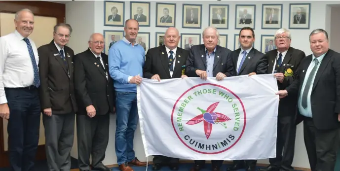  ??  ?? ONE at the Louth County Council Meeting presenting the Fuchsia Flag to the mayor and councillor­s.